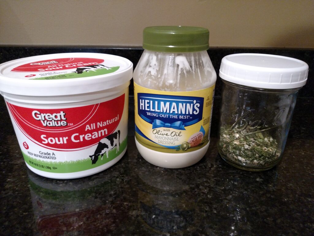 sour cream, mayonnaise and ranch mix on the counter