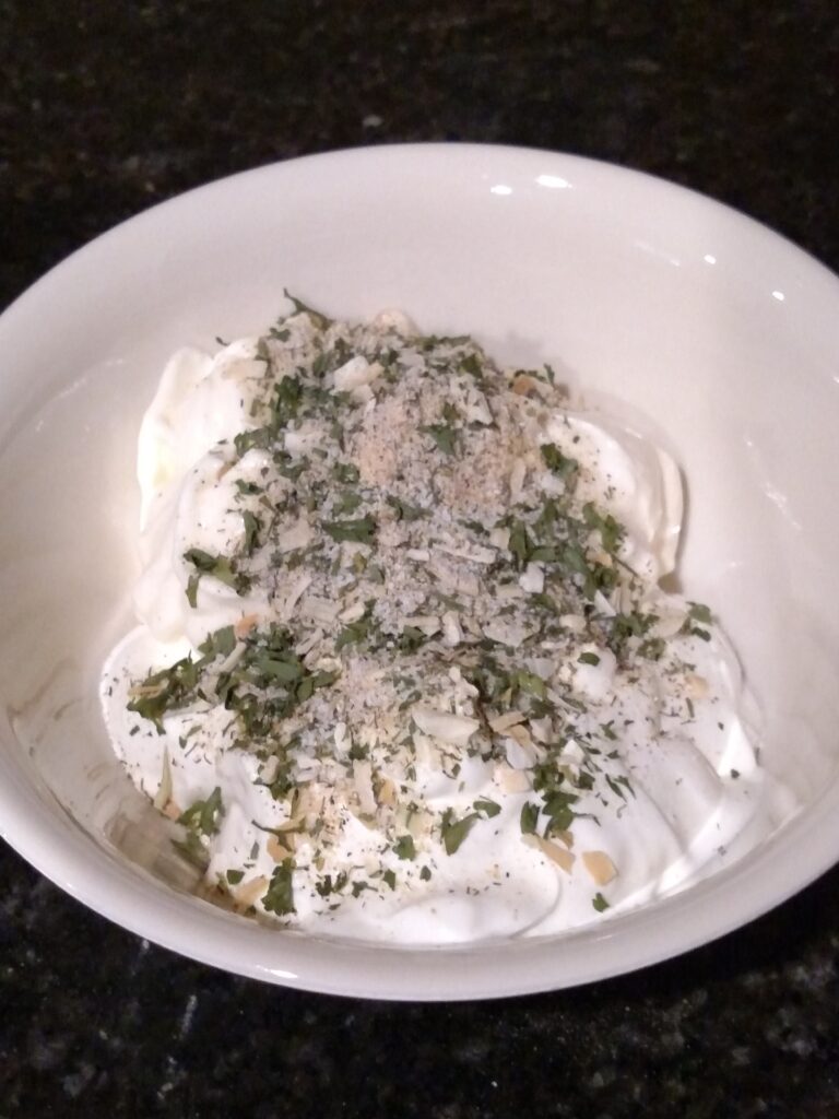 sour cream, mayo and ranch mix in a bowl