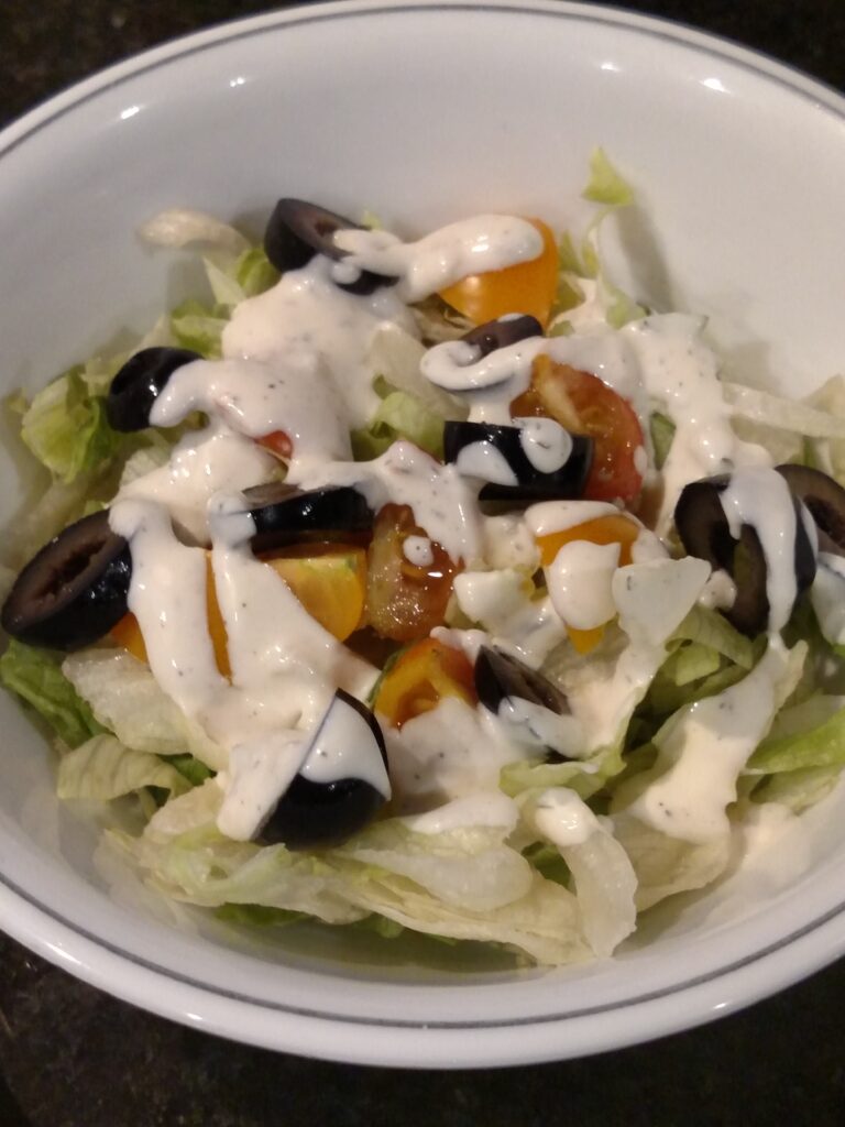 salad in a bowl with ranch dressing