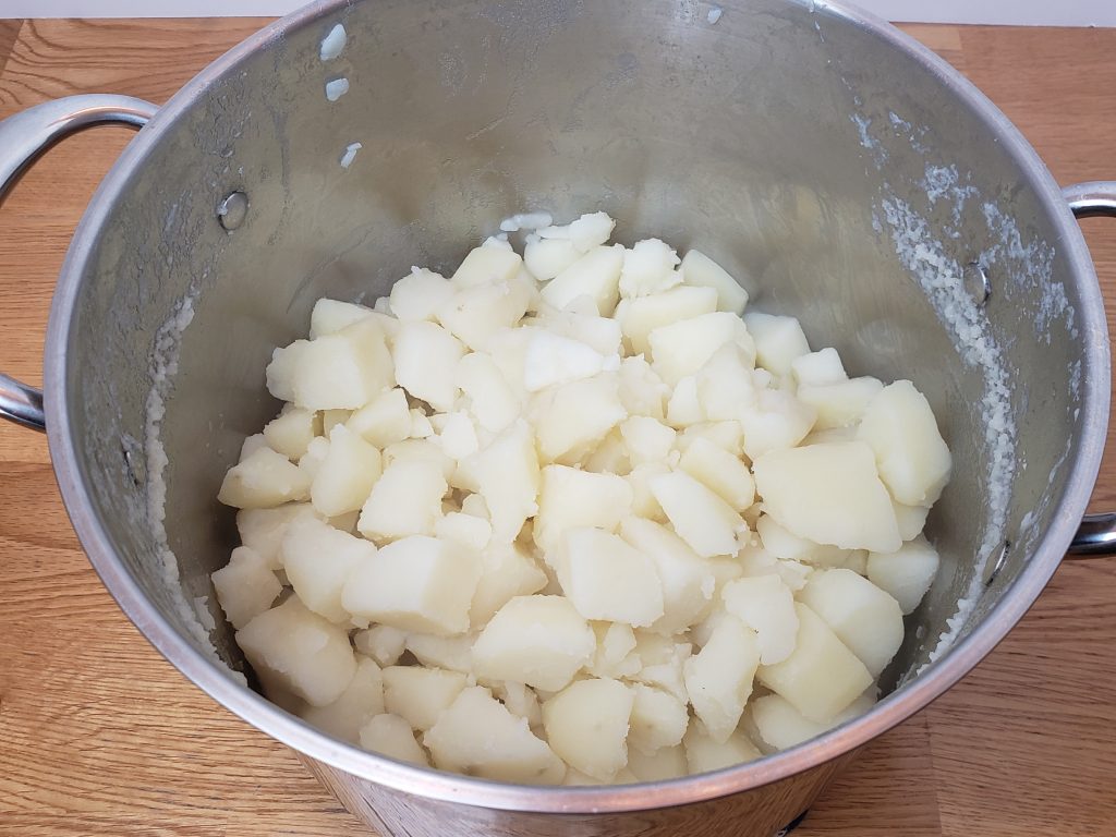 cooked, drained potatoes still in pan