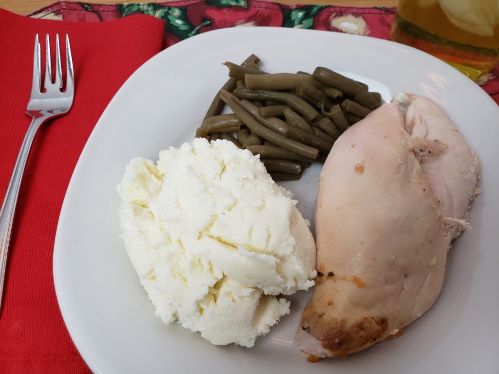 Special Mashed Potatoes on plate with chicken and green beans