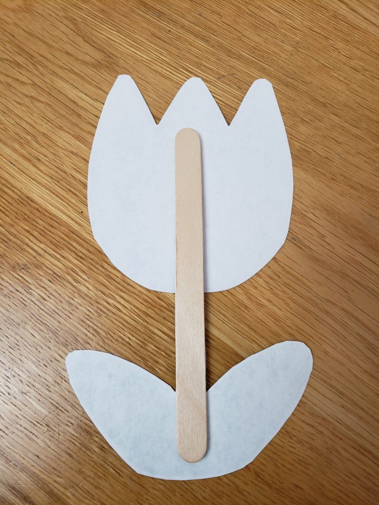 showing the popsicle stick on the back of the flower