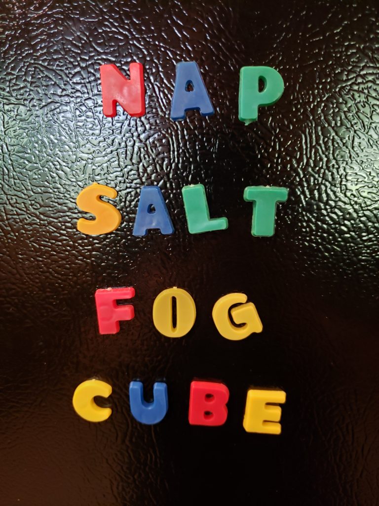 magnetic letters on black refrigerator