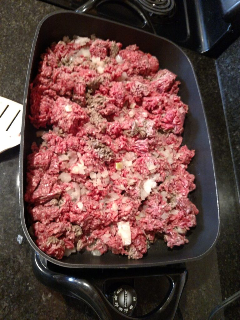 ground beef and onion in skillet