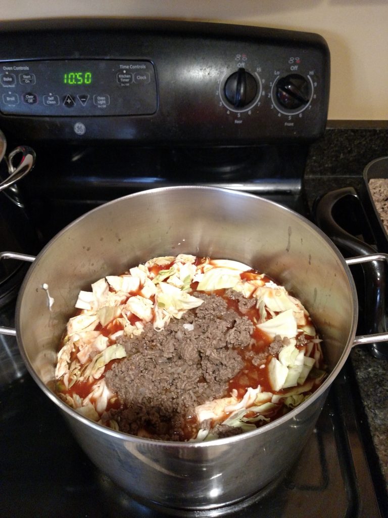 ingredients for beefy lentil soup in saucepan