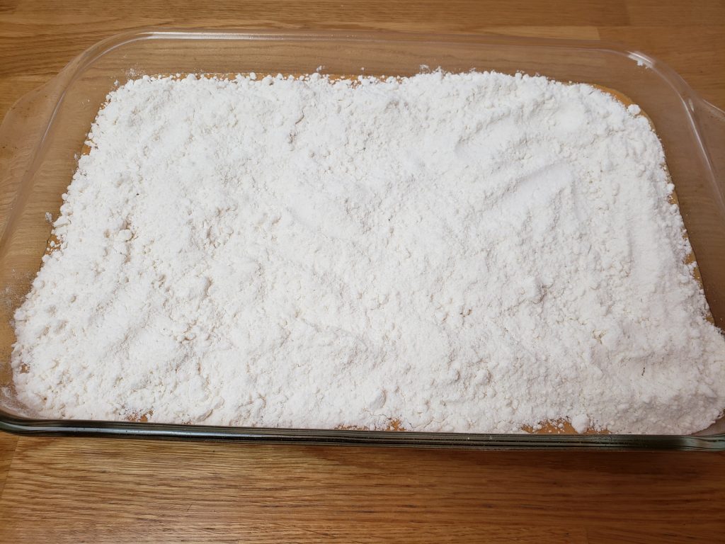 wet ingredients sprinkled with cake mix