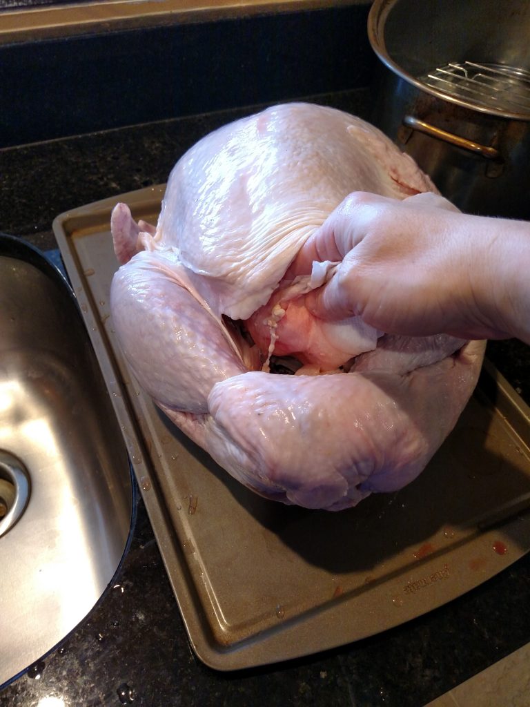 patting inside of turkey dry with paper towels