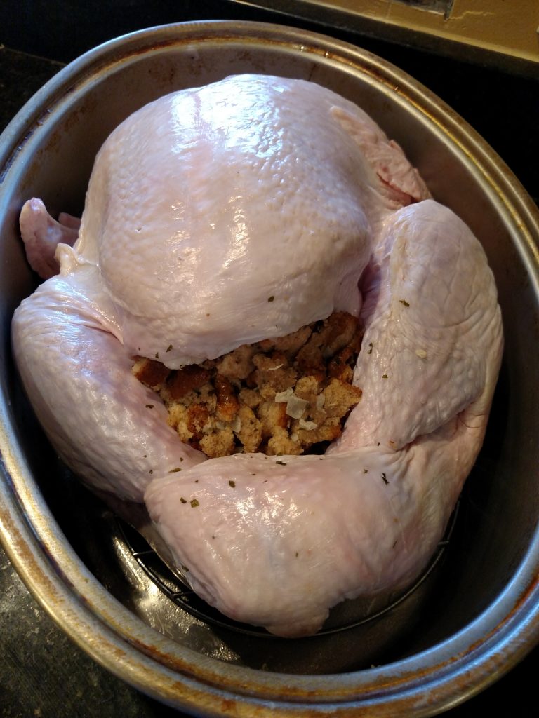 raw turkey with stuffing ready to cook