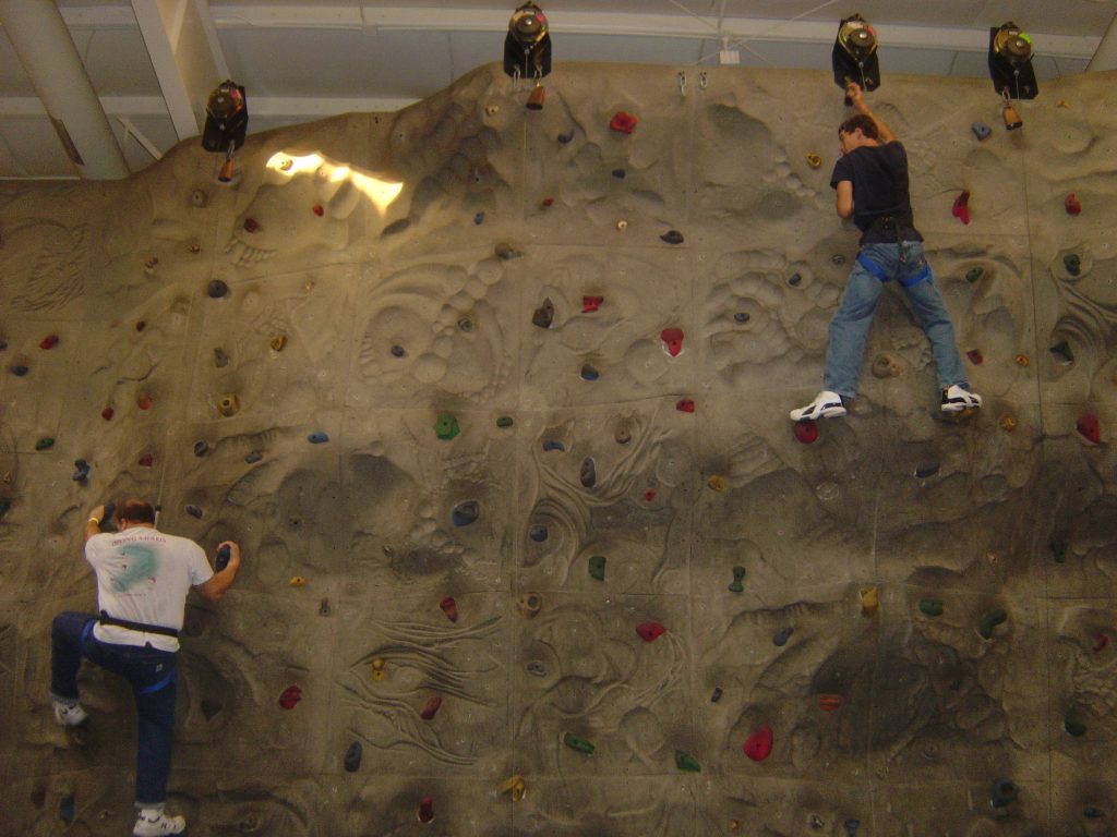 a male teen wall climbing