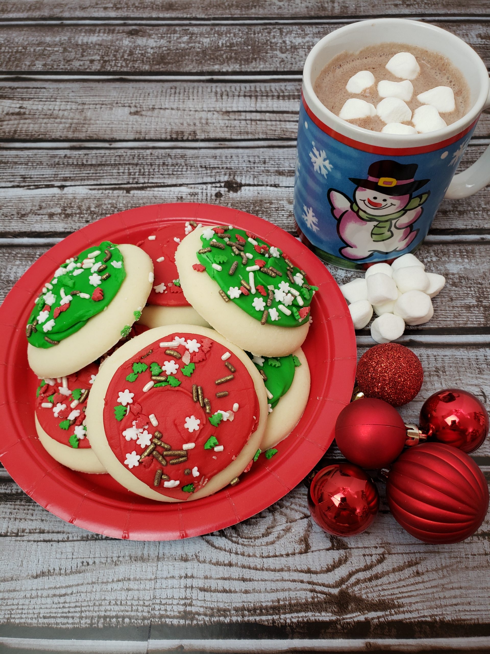 plate of Christmas cookies and hot chocolate