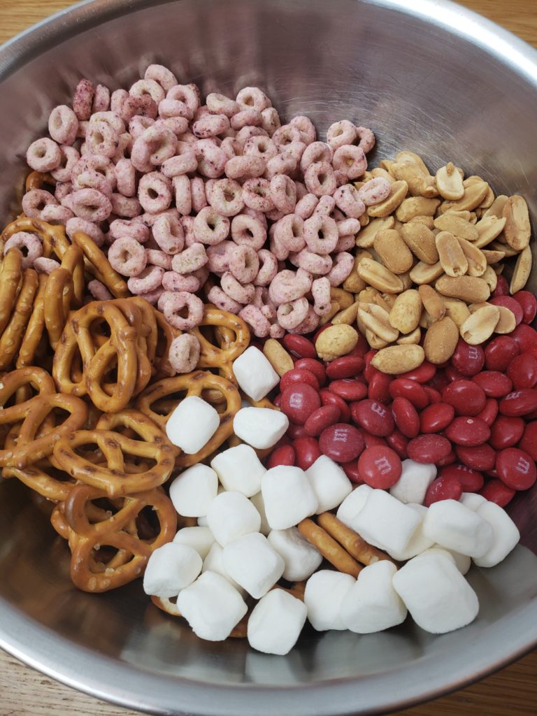 ingredients for Valentine’s Day Trail Mix in silver mixing bowl