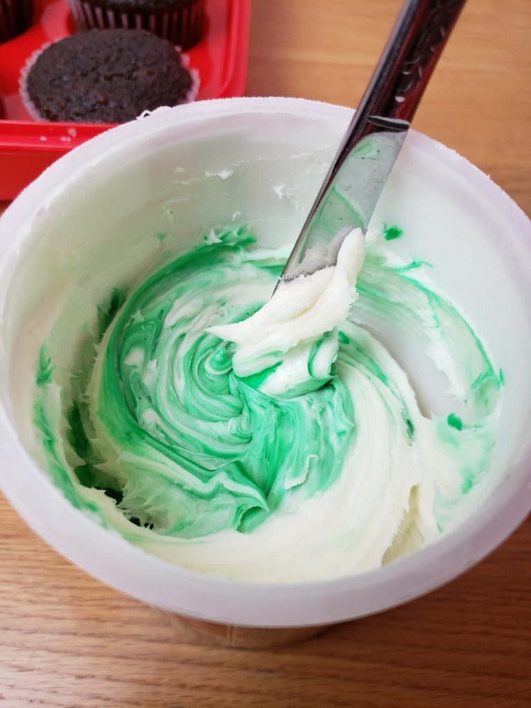 white icing with green food coloring in it