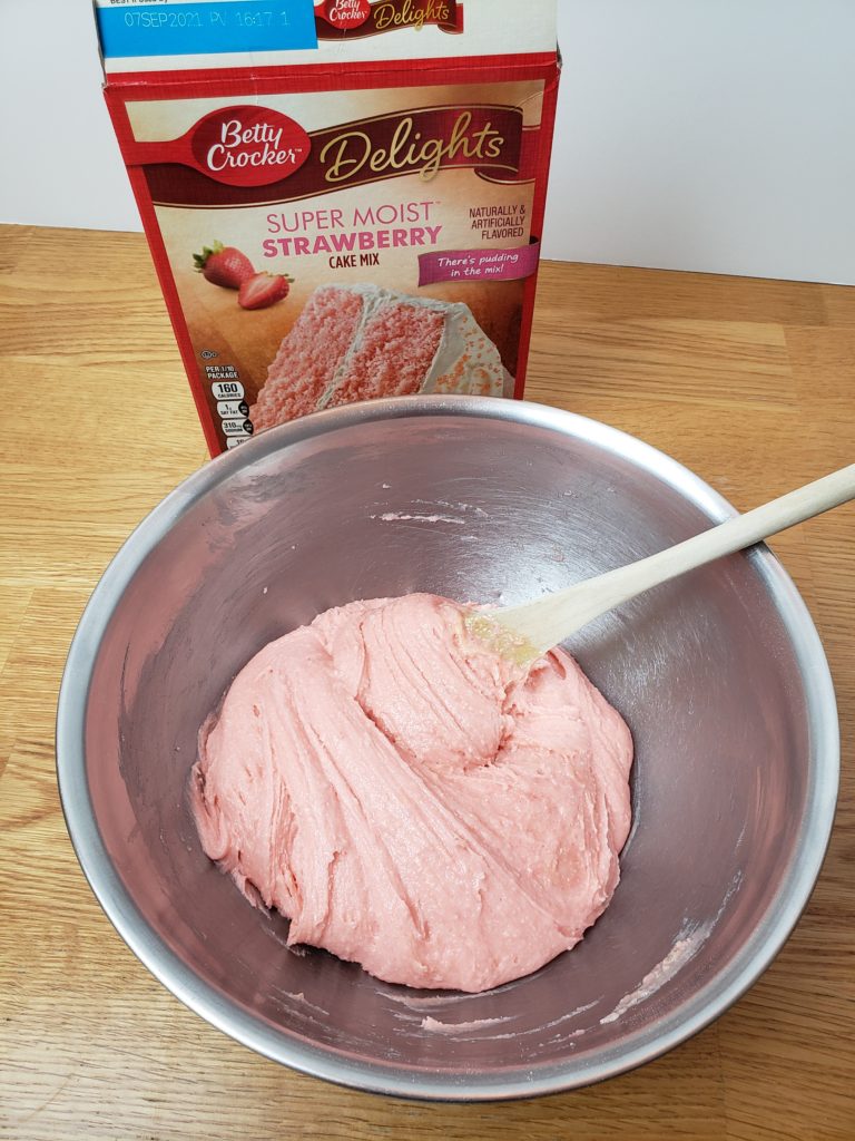 mixing pink cookie dough