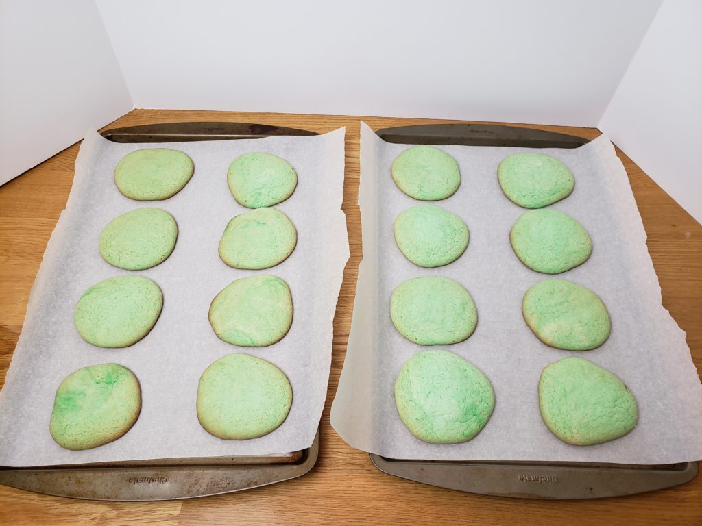 green cookies on cookie sheet baked