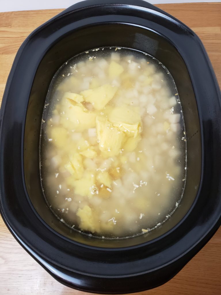 Creamy Crock Pot Potato Soup in crock pot before being stirred in