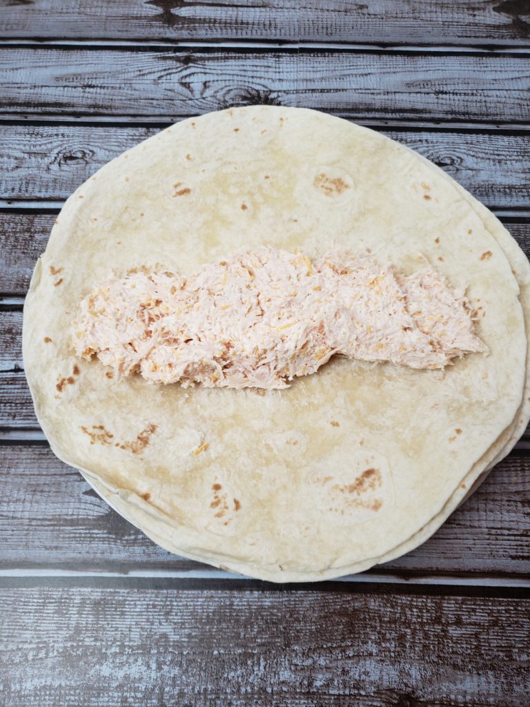 chicken and cheese mixture put on tortilla