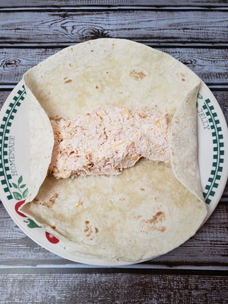 tortilla rolled toward middle on edges