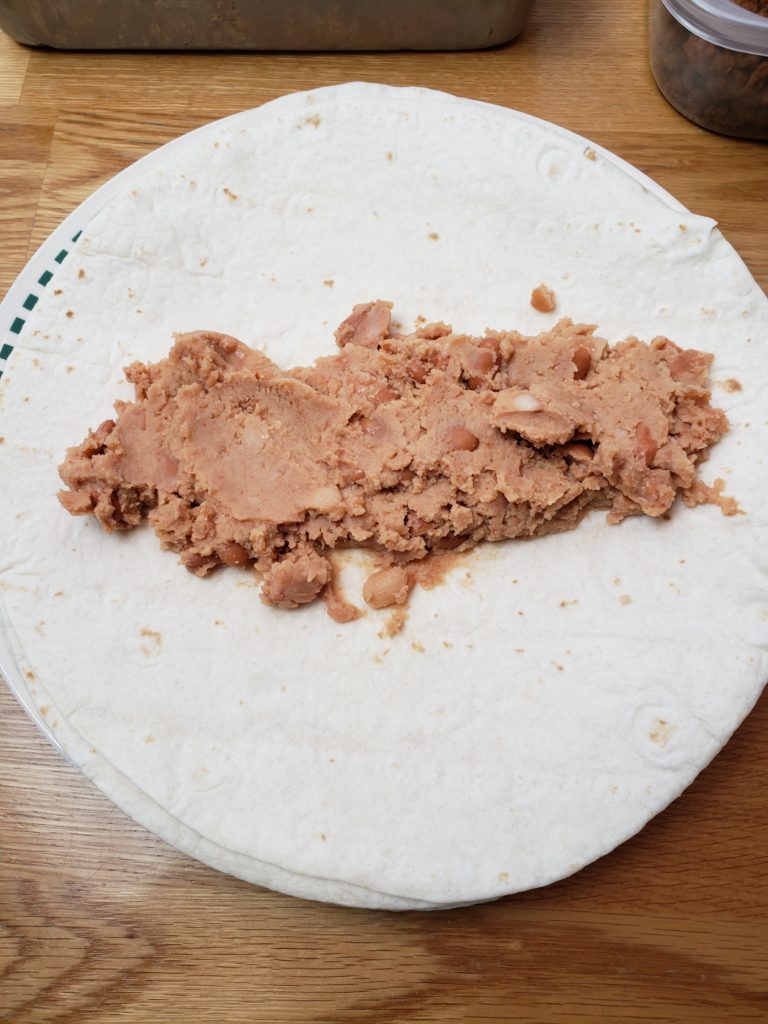 refried beans in enchilada