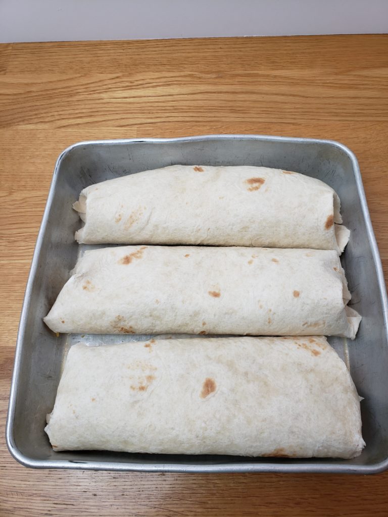 3 enchiladas in baking pan