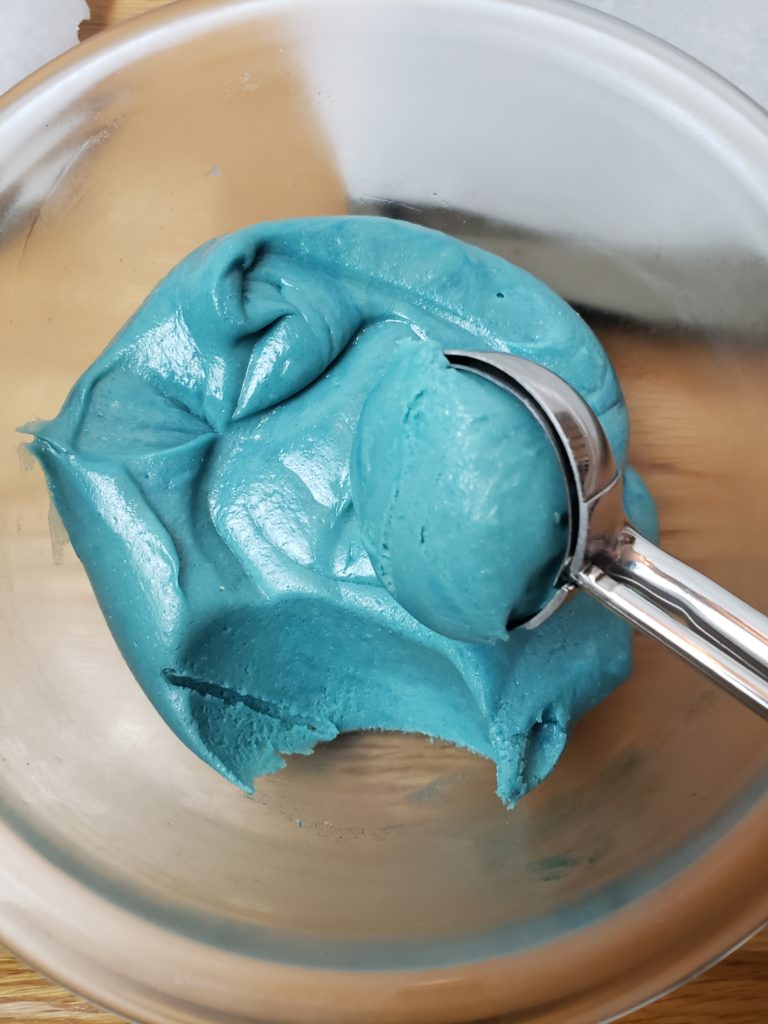 scooping blue cookie dough