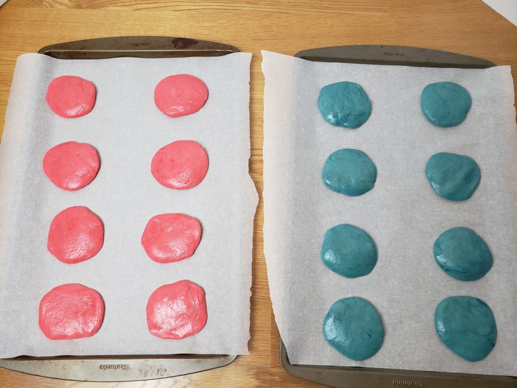 red and blue unbaked cookies on cookie sheet