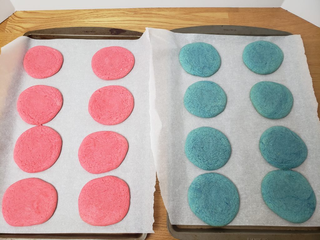 red and blue cookies on cookie sheet