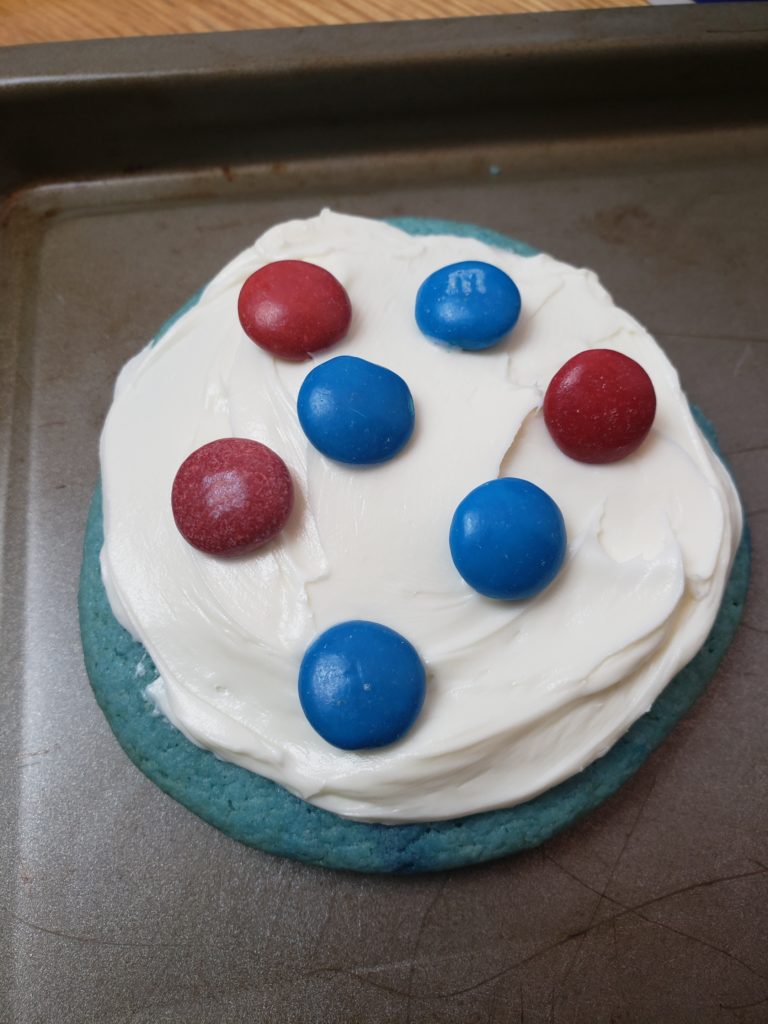 decorating Easy Patriotic Cookies on cookie sheet