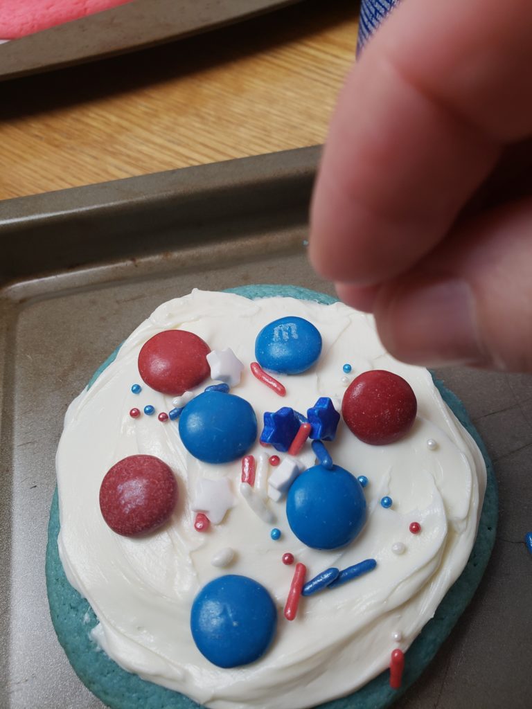 decorating Easy Patriotic Cookies on cookie sheet