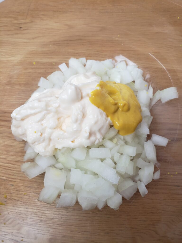 onion relish ingredients in bowl before being mixed together