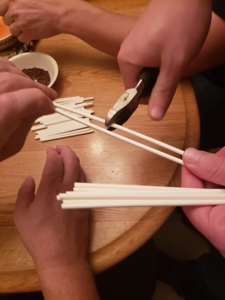 cutting pop sticks in half