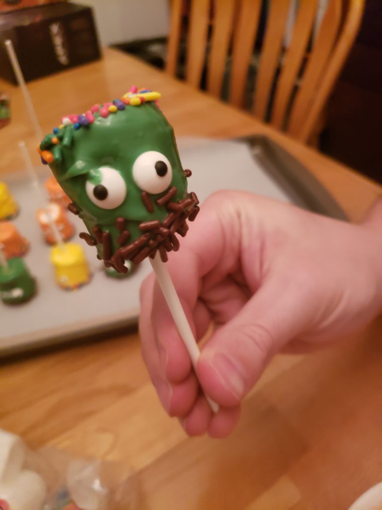 green Halloween Monster Marshmallow Pop with 2 eyes, colored sprinkles for hair and brown for beard