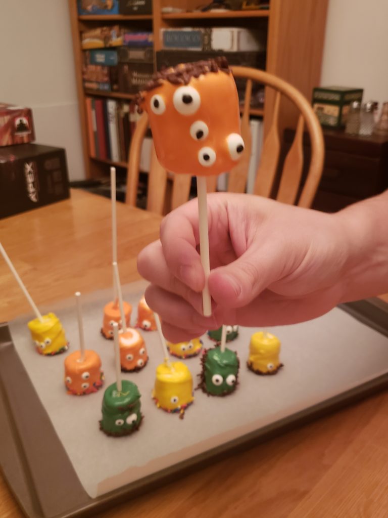 an orange Halloween Monster Marshmallow Pop with 5 eyes