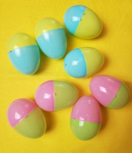 plastic Easter eggs that are half pink and half green and half blue and half yellow