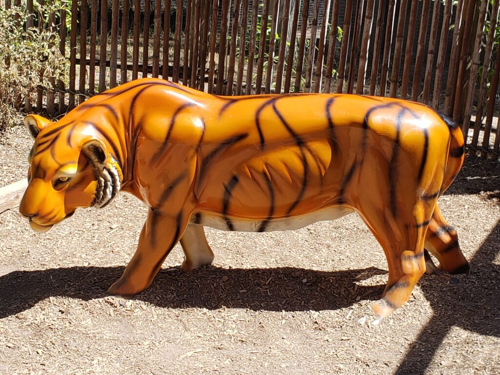 a tiger statue at a zoo