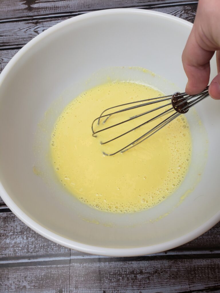 stirring milk and pudding mix in bowl