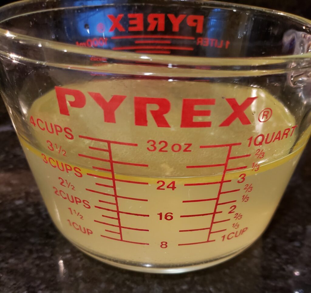 turkey broth in a pyrex glass quart