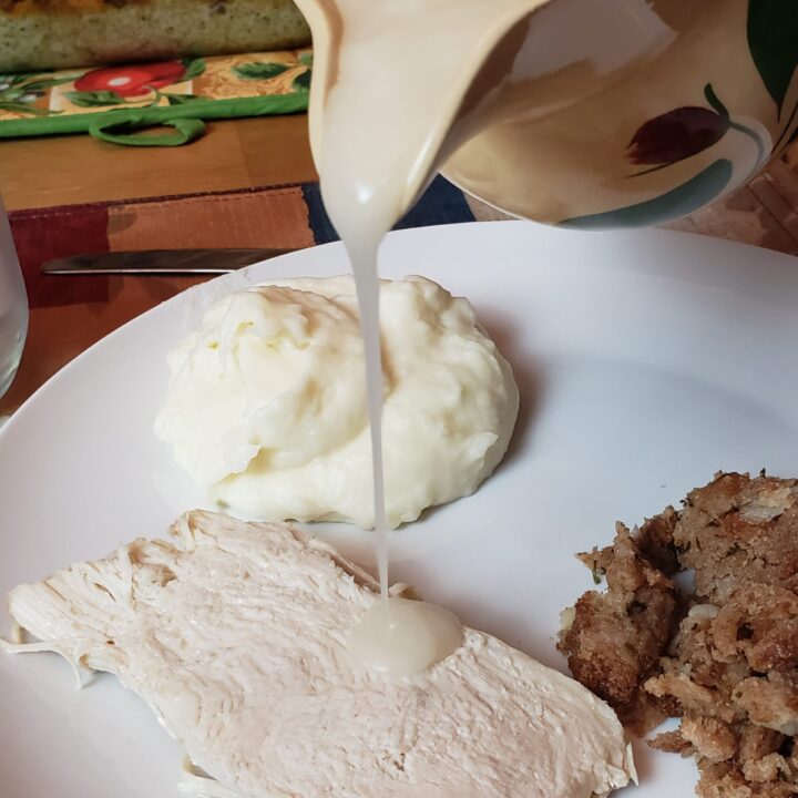 pouring gravy over turkey