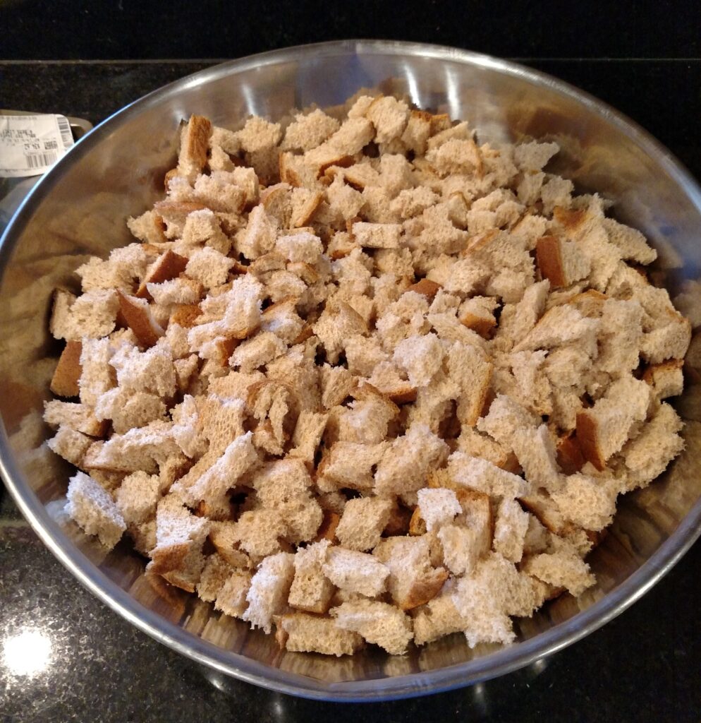 bread broken up into cubes in a big bowl