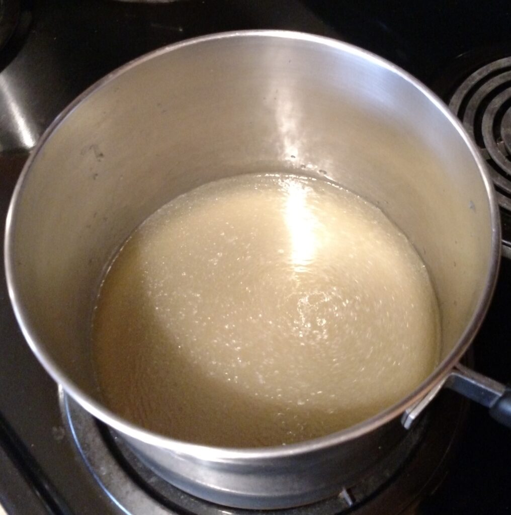 broth in saucepan on stove