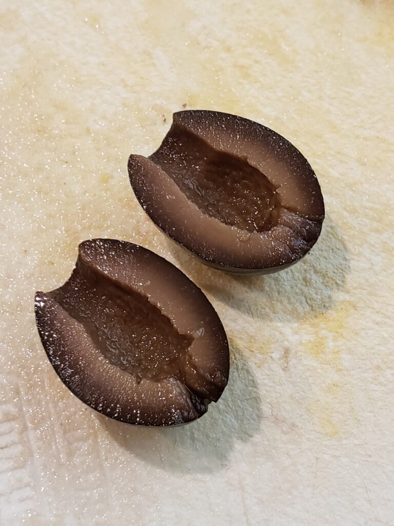 black olive cut in half.