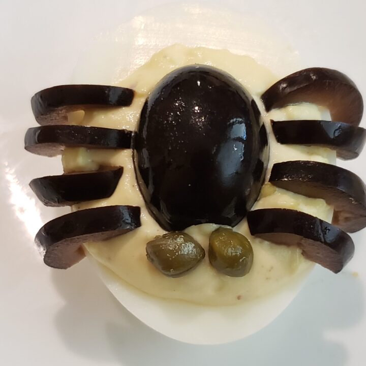 capers added to deviled egg as spider eyes.