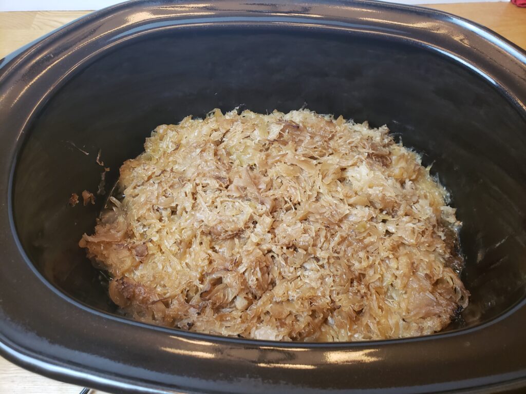 pork and sauerkraut in slow cooker after cooking