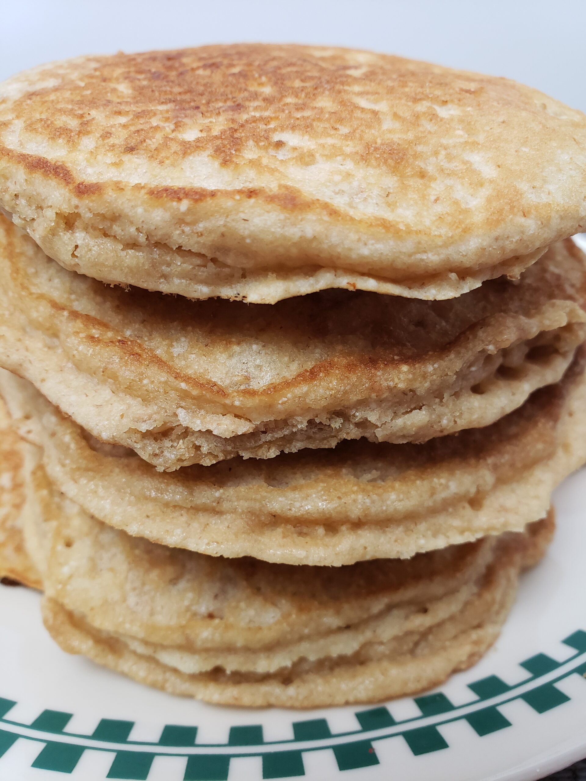 stack of 4 Brown Sugar Oatmeal Pancakes on a plate.