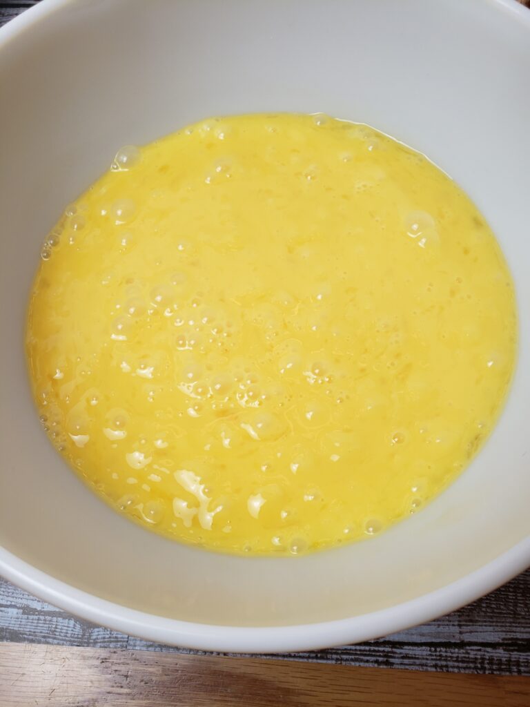 scrambled eggs in mixing bowl.