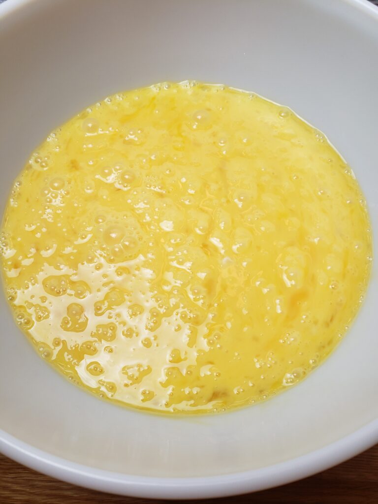 scrambled eggs in mixing bowl.