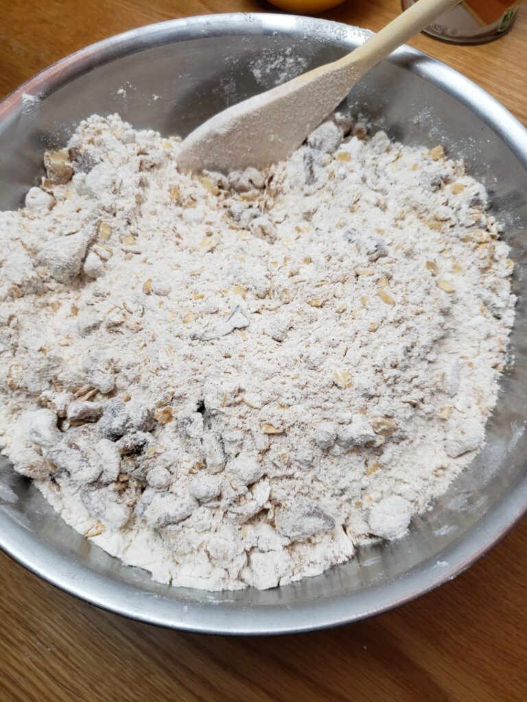 combining dry ingredients in mixing bowl.