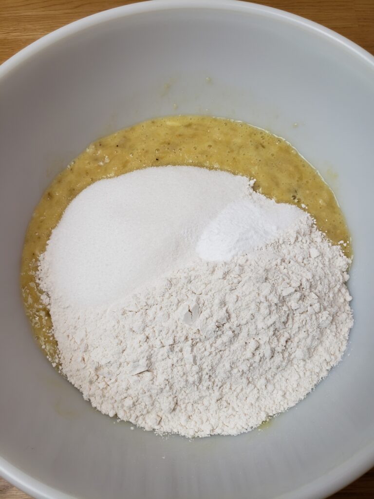 dry ingredients added to eggs and bananas