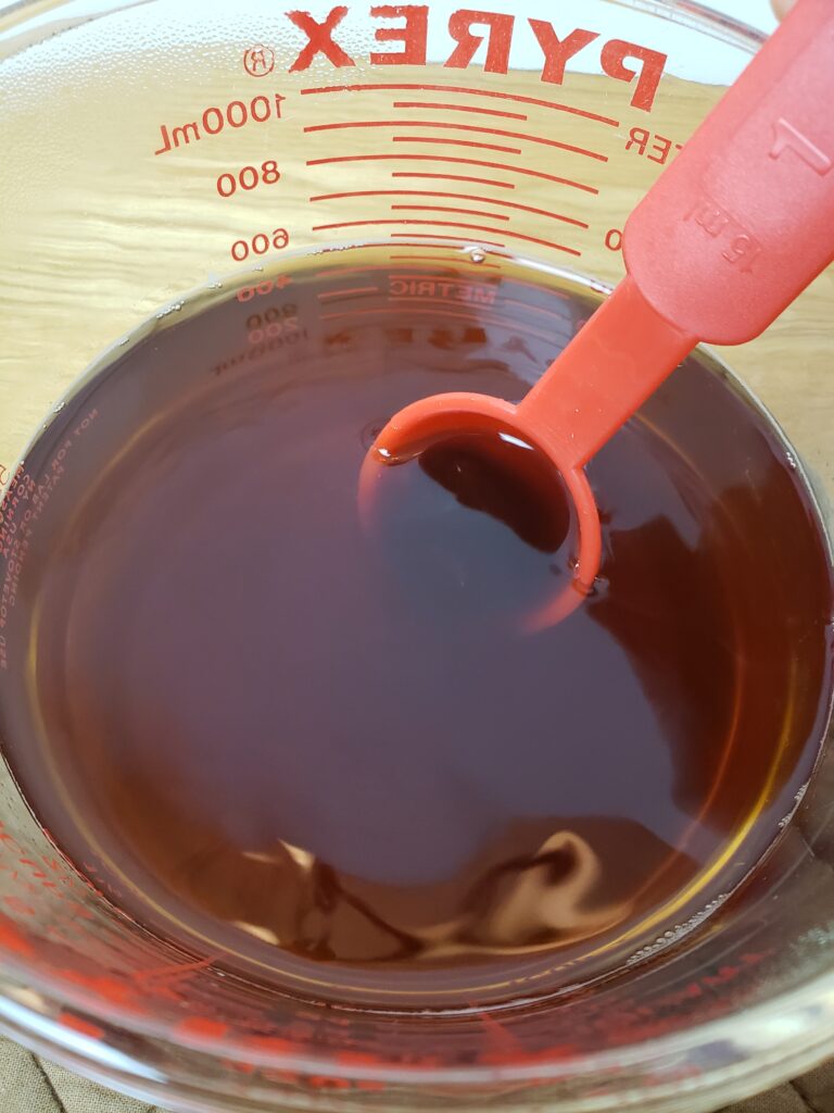 stirring honey into brewed tea.