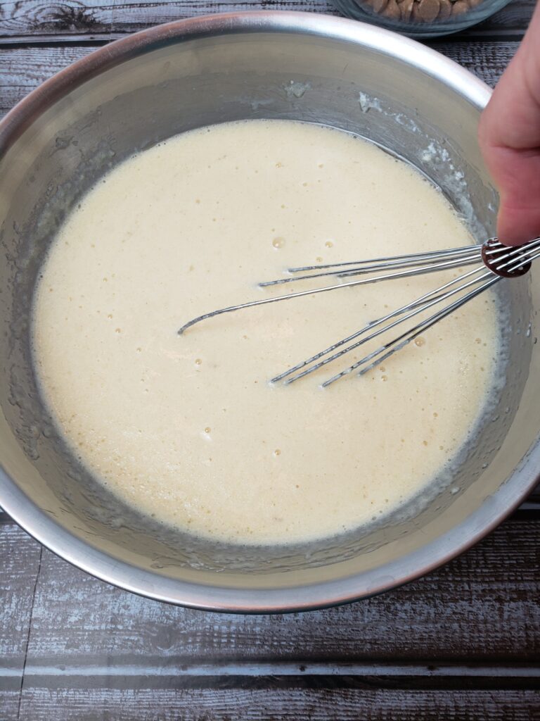 whisking together wet ingredients.