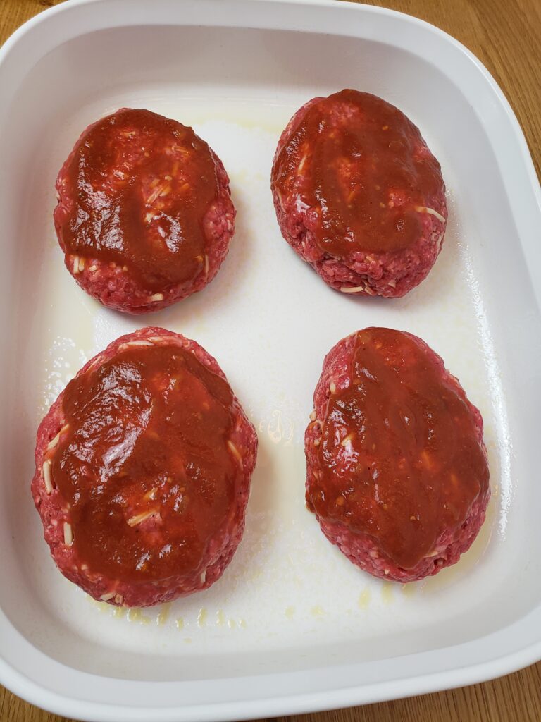 4 Best Gluten Free Low Carb Meatloaf loaves in a white baking dish